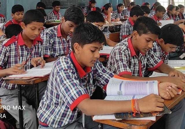 Students studying together in class